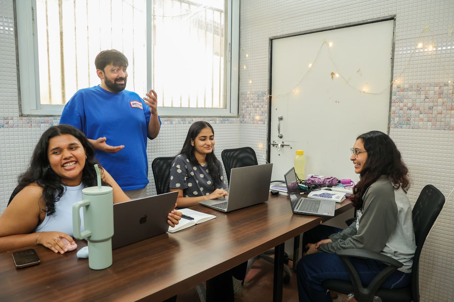 Sahil working through a plan with the crew